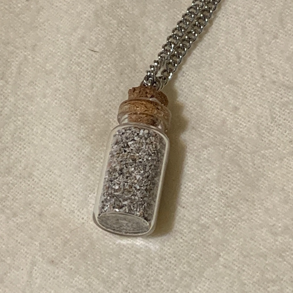 Bottle necklace with sand from the Caribbean.